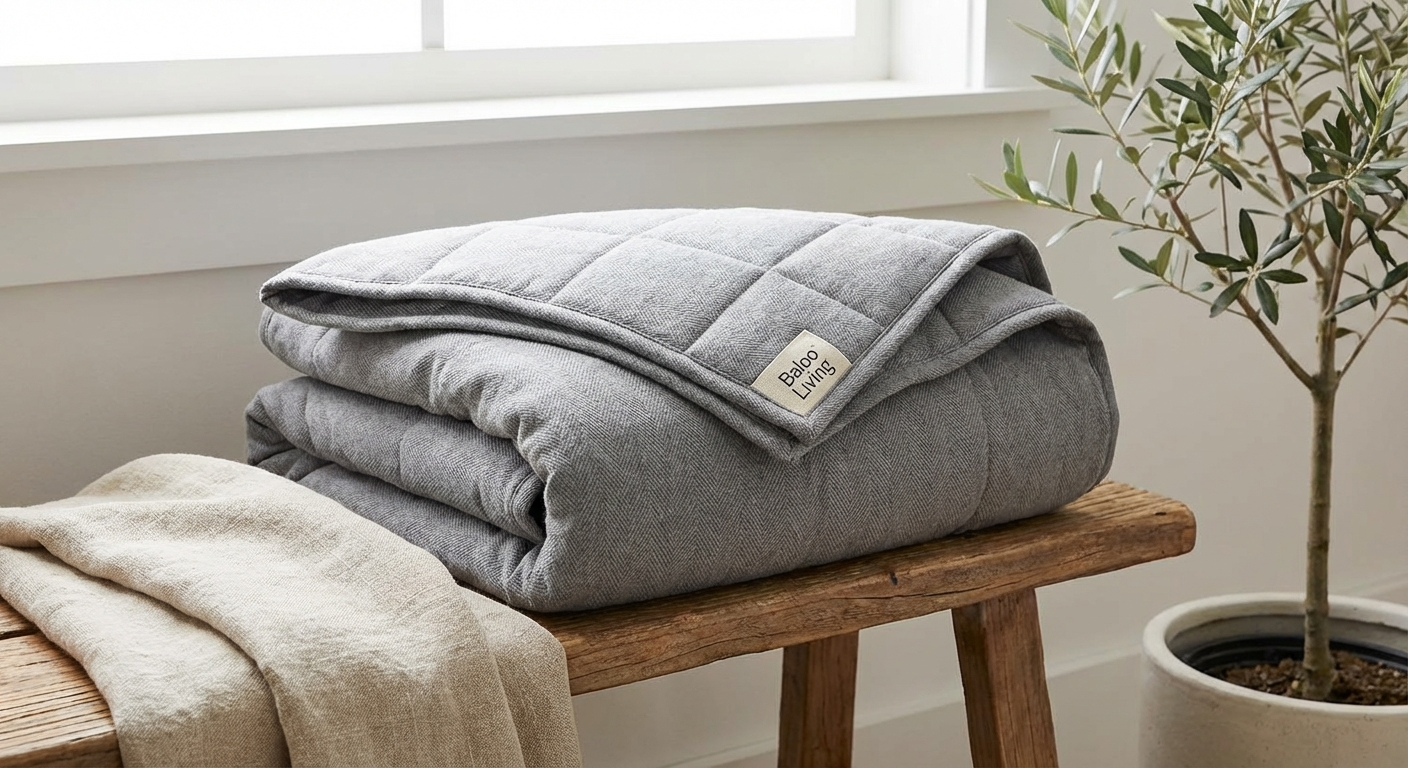 Luna weighted blanket in dark grey showing smooth cotton exterior and consistent quilted pocket pattern